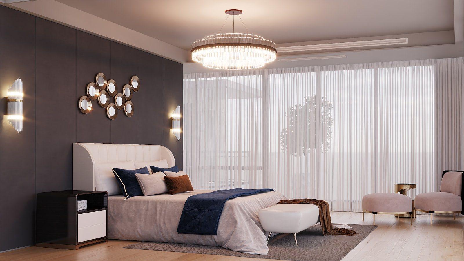 Principal bedroom with an upholstered bed against a panelled wall, a tiered glass chandelier and full-width sheer curtains across the terrace glazing.