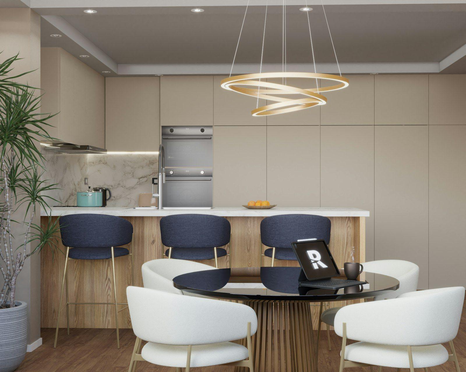 Open-plan kitchen and breakfast area: a timber-fronted island with a marble worktop, bar stools, full-height cabinetry and a round dining table alongside.